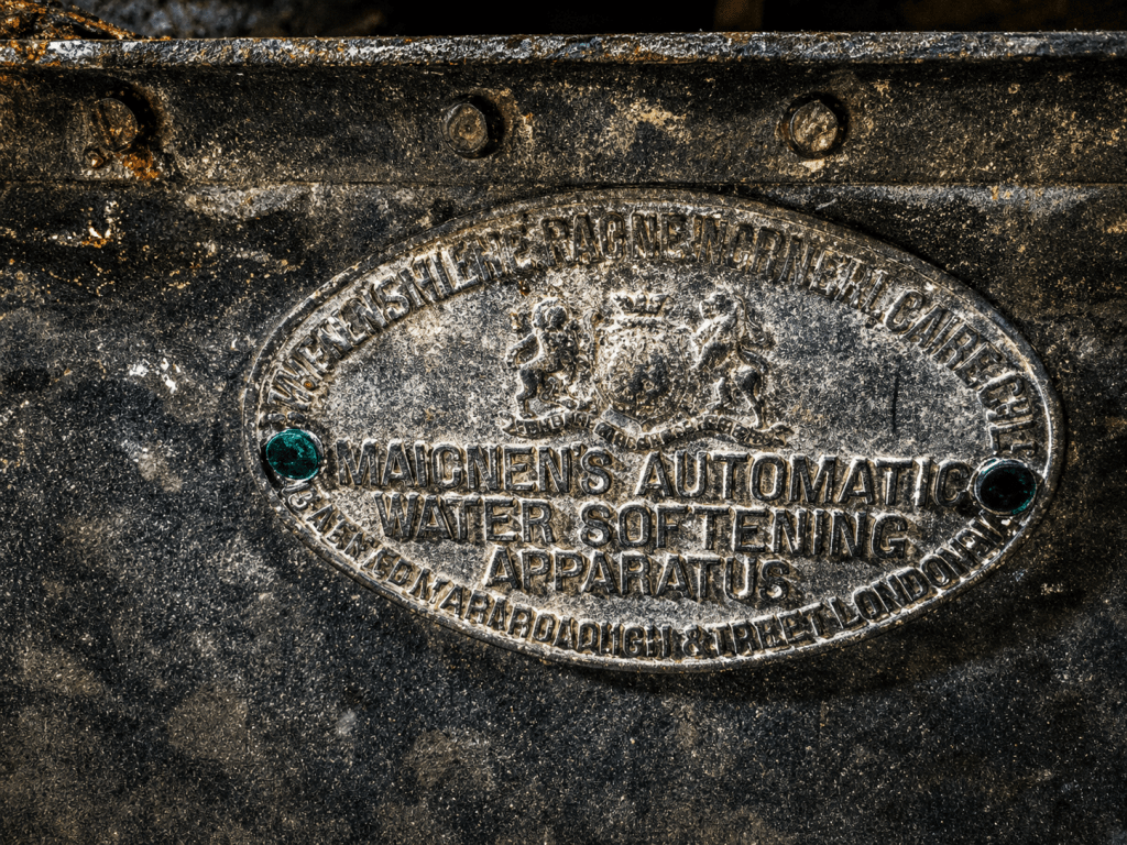 Maignen's Automatic Water Softening Apparatus manufacturer's plaque.